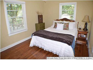 Bedroom 1 with original hardwood floors