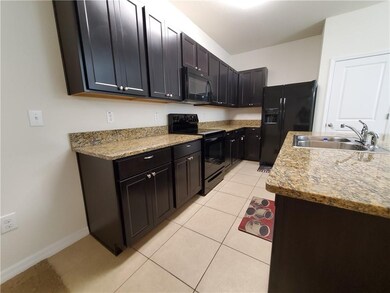 Another view of the kitchen.  The refrigerator in 
