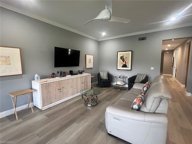 Living room with ceiling fan, hardwood / wood-styl
