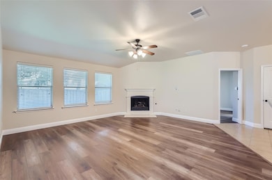 Unfurnished living room featuring tile flooring an