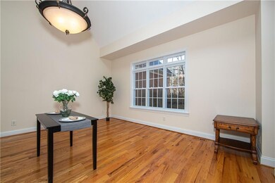 Open concept formal dining room with hardwoods