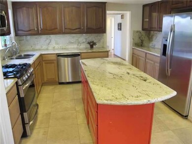 Updated kitchen with granite slab