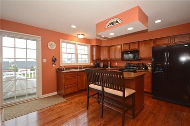 Updated Kitchen with Kitchen Island open to the Di