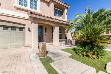 Entrance to property featuring a porch, a tile roof, stucco siding, and a garage