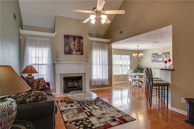 This spacious great room with hardwood flooring and a gas fireplace is the perfect gathering place!