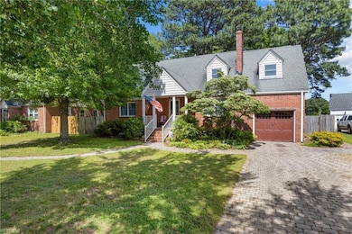 Brick Cape Cod with stone paver driveway and sidewalk