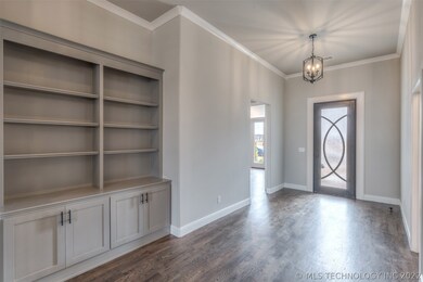 The custom 8ft iron & glass door provides natural