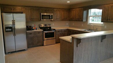 What kitchen will look like once completed/ layout will be reversed/ photo of a similar finished home