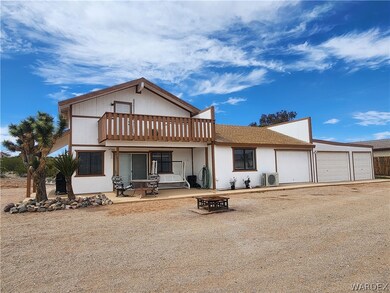 View of front of property with a garage with three
