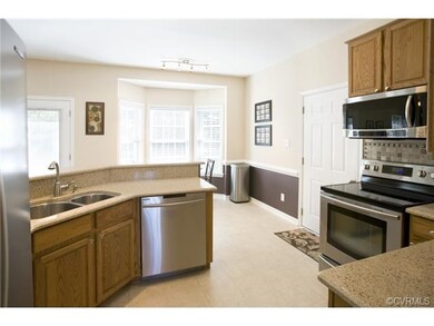 Updated Kitchen featuring quartz countertops, stai