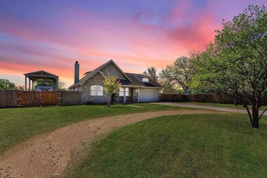 View of front of house featuring concrete drivewa