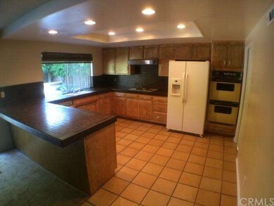 Open and bright kitchen with a great pool view.