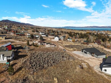 Aerial view of residential area featuring a mountainous background