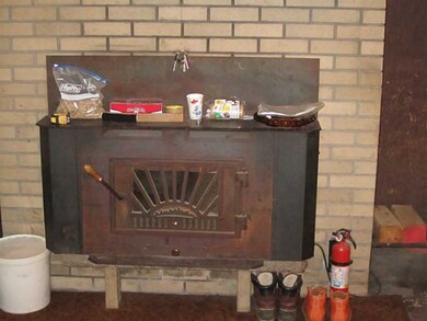 Bonus Room. Wood burning heater in lower level sig