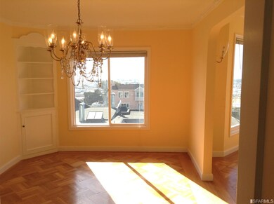The formal dining room with ocean and city views, 