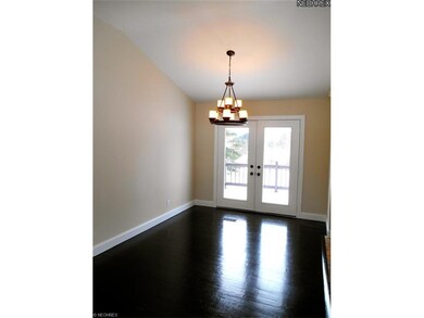 Large dining room with french doors that open onto