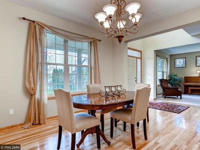 Formal dining room with large window and grand cha