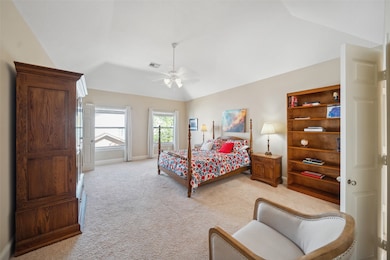 The owner's retreat features a vaulted ceiling, la