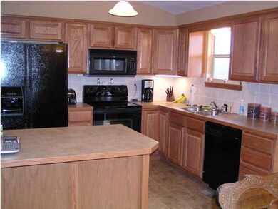 Kitchen offers wonderful prep space and full compl