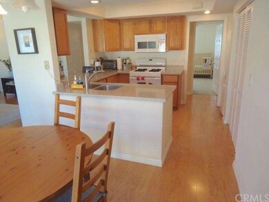 Bright kitchen boasts granite counter tops, new ca
