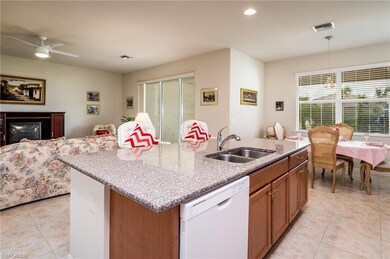 Kitchen has a dining area with a sunny view of the