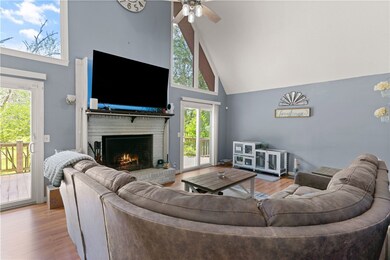 Large family room with vaulted ceilings and firepl
