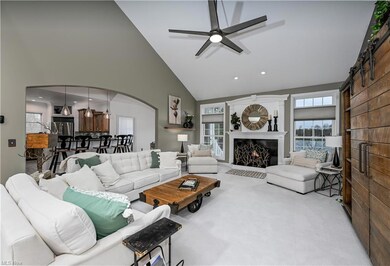 Great Room Opens with Arched Doorway to Kitchen
