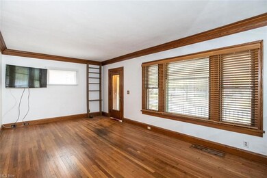 Unpainted wood trim and crown molding throughout the living spaces