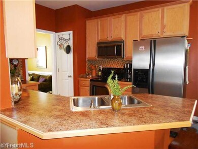 Kitchen. The eating bar is just the place for a quick bite or maybe some conversation with the cook.