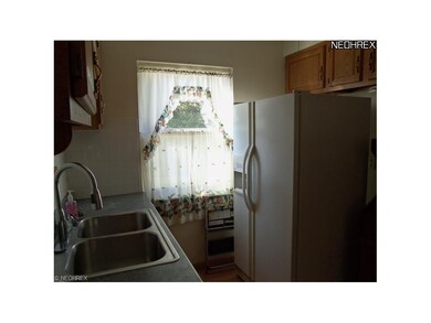 Kitchen with laminate floor and appliances