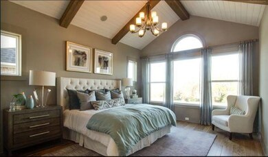 Vaulted ceiling, gray walls, beams on the ceiling, great natural light! Picture from model but using same features listed above!