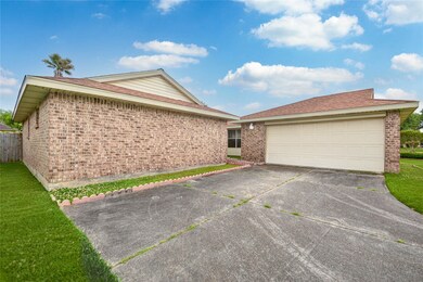 Front - long double wide driveway w/ 2 car attached garage