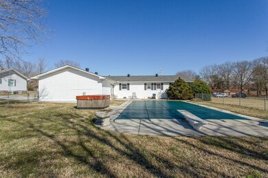 Fantastic in-ground pool with diving board & hot tub!