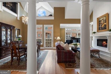Living area with wood finished floors, a high ceil