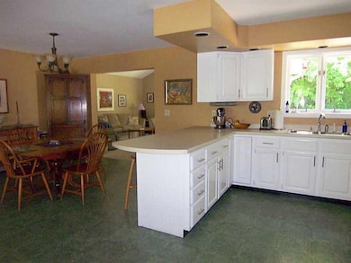 Kitchen. Open to dining area and...