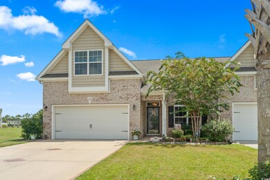 View of front of property featuring a garage and a