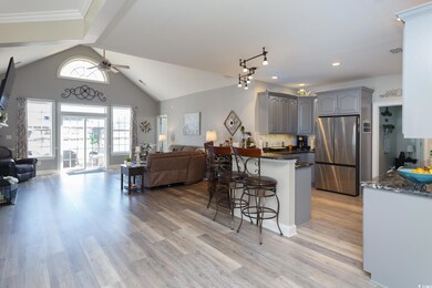 Kitchen with light hardwood / wood-style floors, d