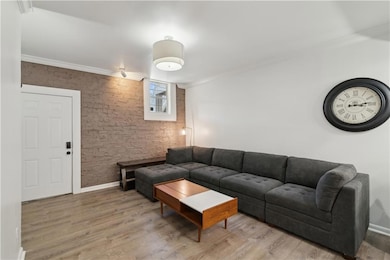 Living room with hardwood / wood-style flooring an
