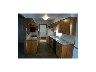 Galley kitchen w/refrigerator, microwave, dishwash