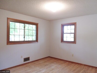 One of the three main floor bedrooms.