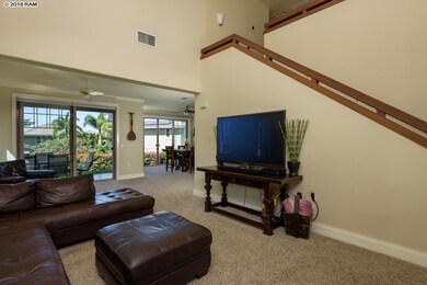 Living room view to exterior lanai & dedicated din