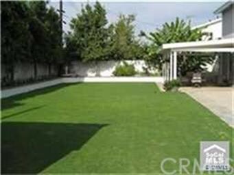 Large rear yard + concrete pad approx. 40 ft.