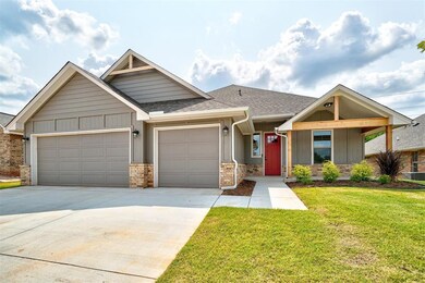 Craftsman inspired home featuring a garage and a f