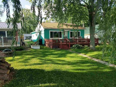 Lakeside of home and yard.