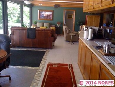 Looking from the nook to the living and kitchen.