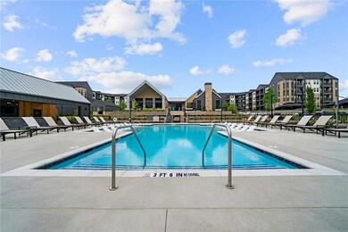 Community pool featuring a patio, fence, and a res