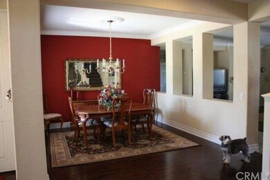 Formal Dining Room with wood floor & crown molding