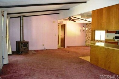 Large open great room complete with cozy woodstove