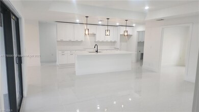 large island, granite counters, stainless steel appliances will be installed prior to closing