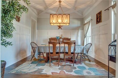 The shoulder height wainscoting and coffered ceiling brings formality and elegance to the Dining Room.